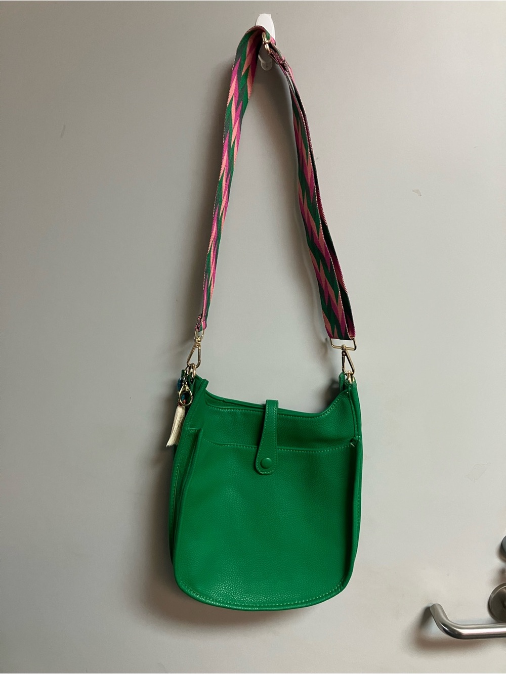 Vibrant Green Crossbody Bag with Multicolor Webbed Strap
